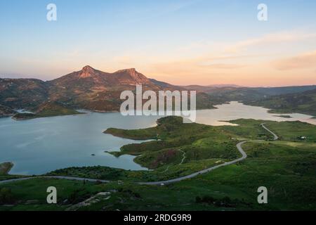 Aerial view of Reservoir Lake with Lagarin and Las Grajas Mountains at sunset - Zahara de la Sierra, Andalusia, Spain Stock Photo