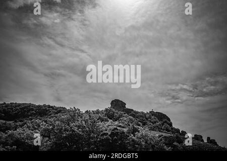 Traveling around Meteora, Greece and its divine complex of monasteries, famous pilgrimage Greek destination. Black and white Stock Photo