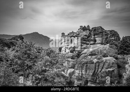 Traveling around Meteora, Greece and its divine complex of monasteries, famous pilgrimage Greek destination. Black and white Stock Photo