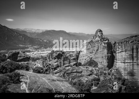 Traveling around Meteora, Greece and its divine complex of monasteries, famous pilgrimage Greek destination. Black and white Stock Photo