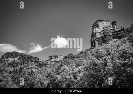 Traveling around Meteora, Greece and its divine complex of monasteries, famous pilgrimage Greek destination. Black and white Stock Photo