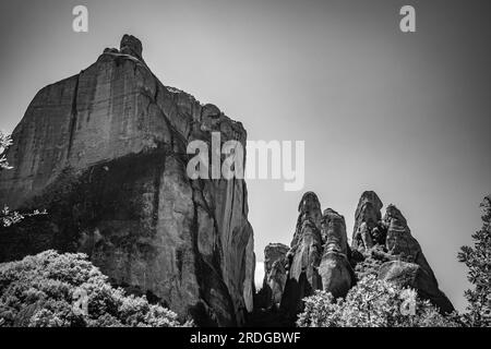 Traveling around Meteora, Greece and its divine complex of monasteries, famous pilgrimage Greek destination. Black and white Stock Photo