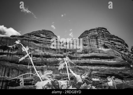 Traveling around Meteora, Greece and its divine complex of monasteries, famous pilgrimage Greek destination. Black and white Stock Photo