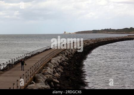 View of Neptune's Arm, Herne Bay, looking along the coast towards St Mary's Church, Reculver Stock Photo