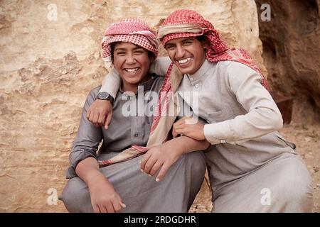 Portrait of two young Bedouins, Wadi Rum, Aquaba, Jordan Stock Photo