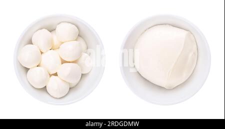Mozzarella, mini balls (bambini bocconcini) and a large ball, in white bowls. Fresh white Italian cheese made from milk by the pasta filata method. Stock Photo