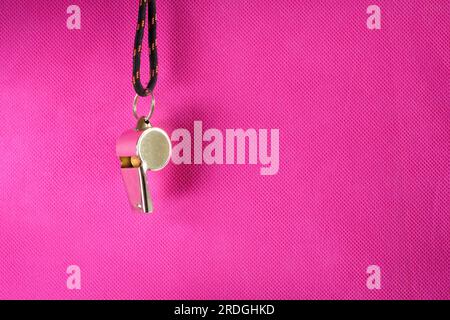 Great womens soccer event, whistle of soccer referee or trainer on pink background Stock Photo