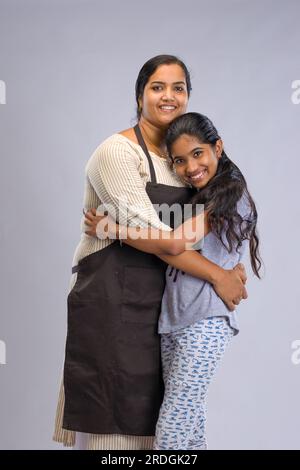 Indian women chef, potrait of a lady wearing apron with white background, isolated Stock Photo