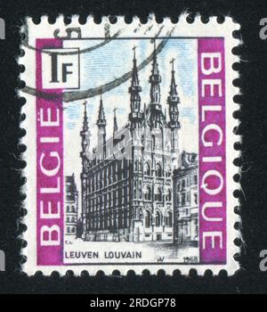 RUSSIA KALININGRAD, 19 OCTOBER 2015: stamp printed by Belgium, shows City Hall Louvain, circa 1968 Stock Photo