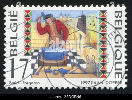 RUSSIA KALININGRAD, 26 OCTOBER 2015: stamp printed by Belgium, shows Blacksmith, circa 1997 Stock Photo