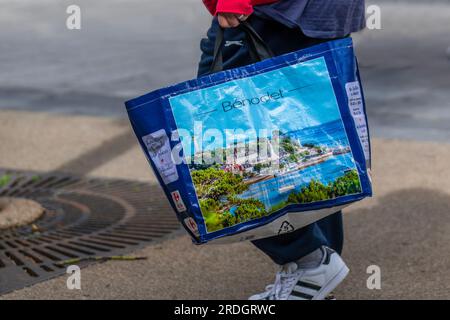 Bénodet Reusable, recycled plastic woven shopping bag illustrated with image of a commune in the Finistère department and administrative region of Brittany in north-western France. Stock Photo