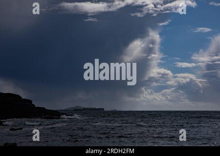 Squall over the Treshnish Isles, viewed from Haunn, Isle of Mull Stock Photo