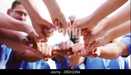 Volunteer Charity Team Joining Hands Together. Teamwork Concept Stock Photo