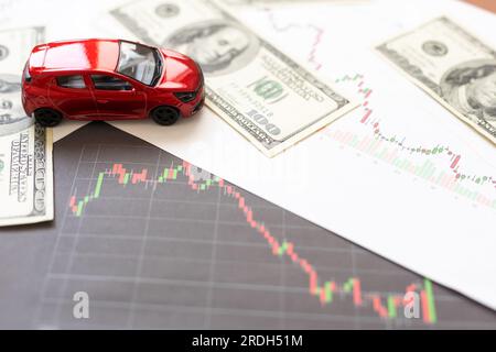 Toy car, money, documents and calculator on table. Car insurance concept Stock Photo