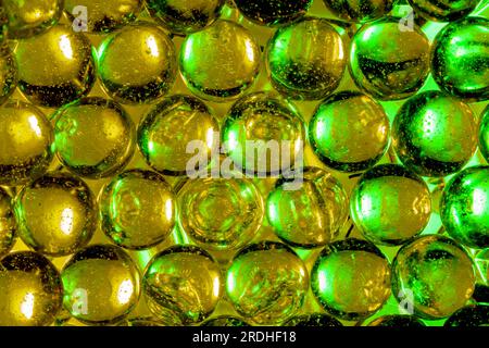 Multiple colored, back lit clear marbles Stock Photo