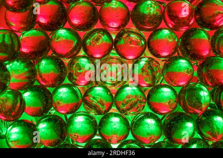Multiple colored, back lit clear marbles Stock Photo