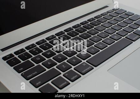 Detailed zoom reveals the perfection of the laptop's keys and keyboard from every angle. Stock Photo