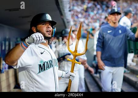 Seattle Mariners' Eugenio Suarez holds up a heart after hitting a