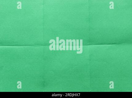 Folded green paper for background. Stock Photo