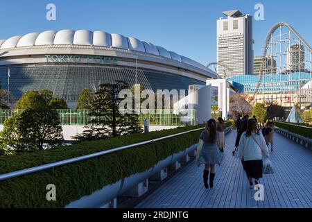 People walk near Tokyo Dome. Tokyo, Japan. Stock Photo