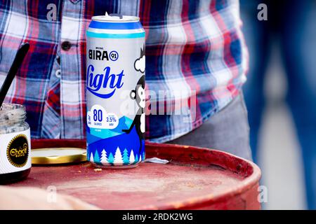 Can of Bira light beer placed on top of a table in an outdoor venue showing this popular indian crafted beer brand Stock Photo