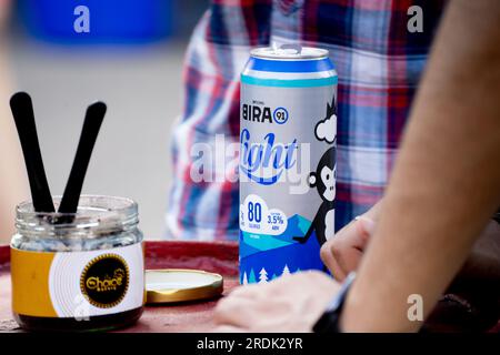 Can of Bira light beer placed on top of a table in an outdoor venue showing this popular indian crafted beer brand Stock Photo
