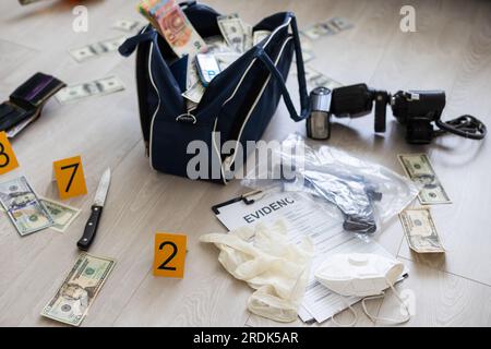 Handcuffs on many stacks of dollar bills. Metal suitcase with money, concept of arrest, investigation and fraud. Stock Photo