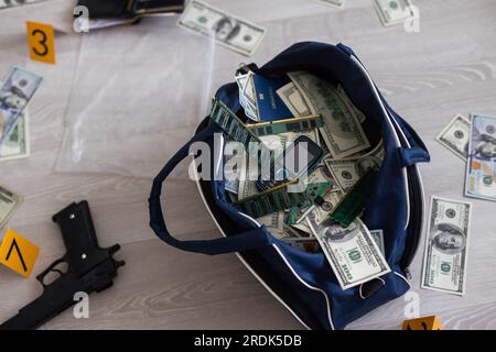 robbers in black bag with money Stock Photo