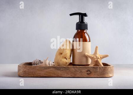 Brown glass bottle for mockup of care cosmetics products. Bath products concept. Stock Photo