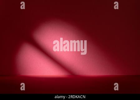 Abstract red studio background for product presentation. Backdrop with shadows of window for display product. Stock Photo