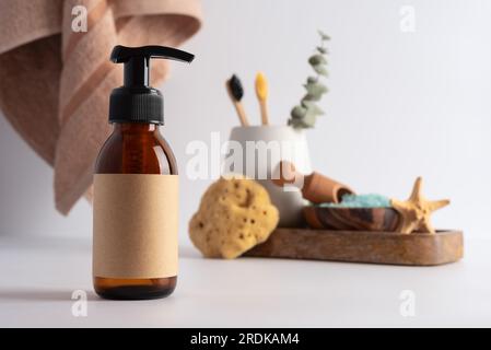 Brown glass bottle for mockup of care cosmetics products. Bath products concept. Stock Photo