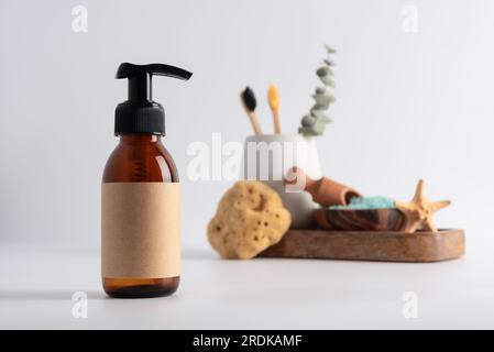 Brown glass bottle for mockup of care cosmetics products. Bath products concept. Stock Photo