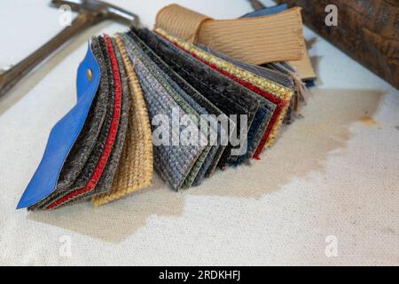 Carpet sample pieces in various colors made of robust plant fibers for natural and eco-friendly interior design, copy space, selected focus, narrow de Stock Photo