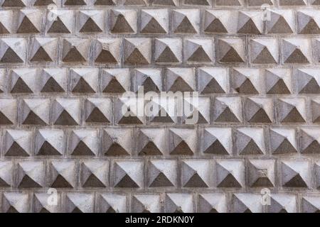 Geometric facade of The Casa de los Picos, historic Renaissance building in Segovia, Spain, with characteristic facade of carved granite blocks. Stock Photo