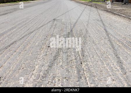 removed the old asphalt from the road. Road repair concept. Stock Photo