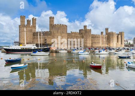 Caernarfon Castle on the Seiont River and the Menai Strait in North Wales Stock Photo