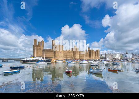 Caernarfon Castle on the Seiont River and the Menai Strait in North Wales Stock Photo