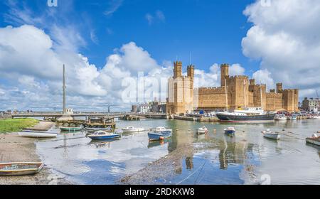 Caernarfon Castle on the Seiont River and the Menai Strait in North Wales Stock Photo