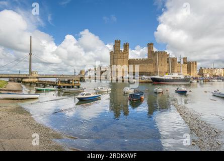 Caernarfon Castle on the Seiont River and the Menai Strait in North Wales Stock Photo