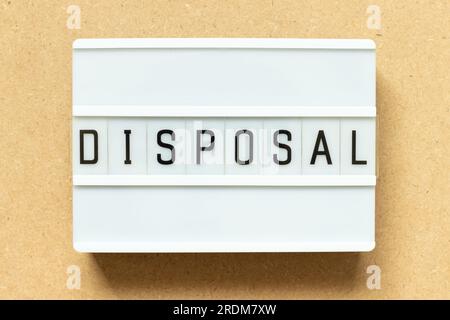 Lightbox with word disposal on wood background Stock Photo