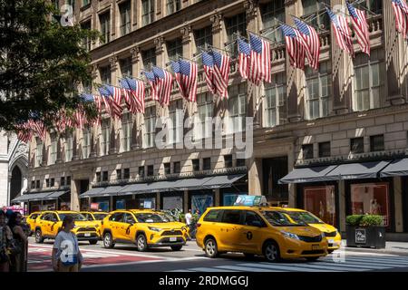 American Flags on facade of Saks Fifth Avenue, New York City , USA  2023 Stock Photo