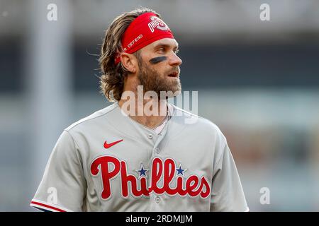 Philadelphia Phillies' Bryce Harper looks to the field from the dugout ...