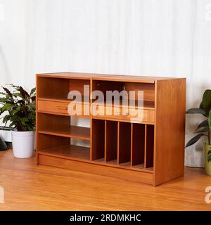 Vintage teak media console. Mid-Century Modern record storage cabinet. Stock Photo