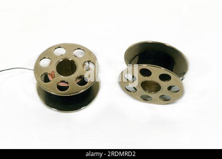 Sewing Machine Spools and Black Thread Stock Photo