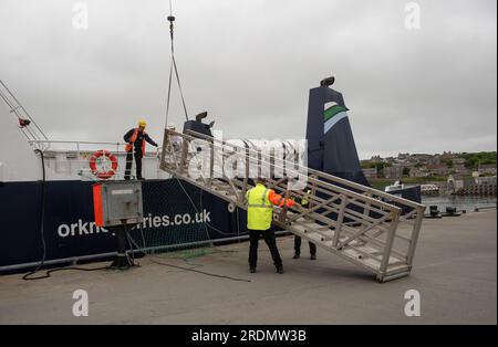 Kirkwall, Orkneys, Scotland, UK. 4 June 2023.  Lifting a ships metal gangway into place on an inter island ferry berthed in Kirkwall, Scotland UK. Stock Photo
