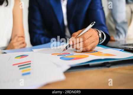 financial statistics at office meeting room. finance data and graphs charts on the table. Stock Photo