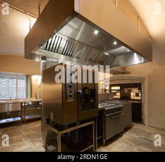 Modern kitchen with extraction hood. York Mansion House, York, United Kingdom. Architect: De Matos Ryan, 2018. Stock Photo