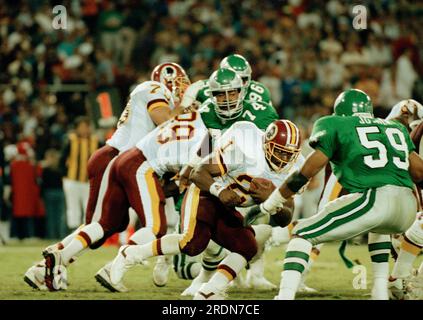 Washington Redskins running back Earnest Byner (21) confronts Philadelphia  Eagles line back Seth Joyner during the second half action at RFK Stadium  in Washington D.C., Oct. 1, 1991. Byner scored one touchdown