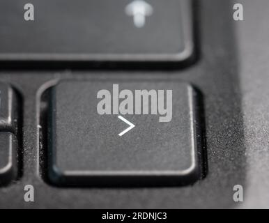 Right arrow key on a black laptop keyboard Stock Photo