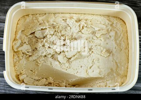 Traditional plain tahini halva or Halawa Tahiniya, the primary ingredients in this confection are sesame butter or paste (tahini), and sugar, glucose Stock Photo